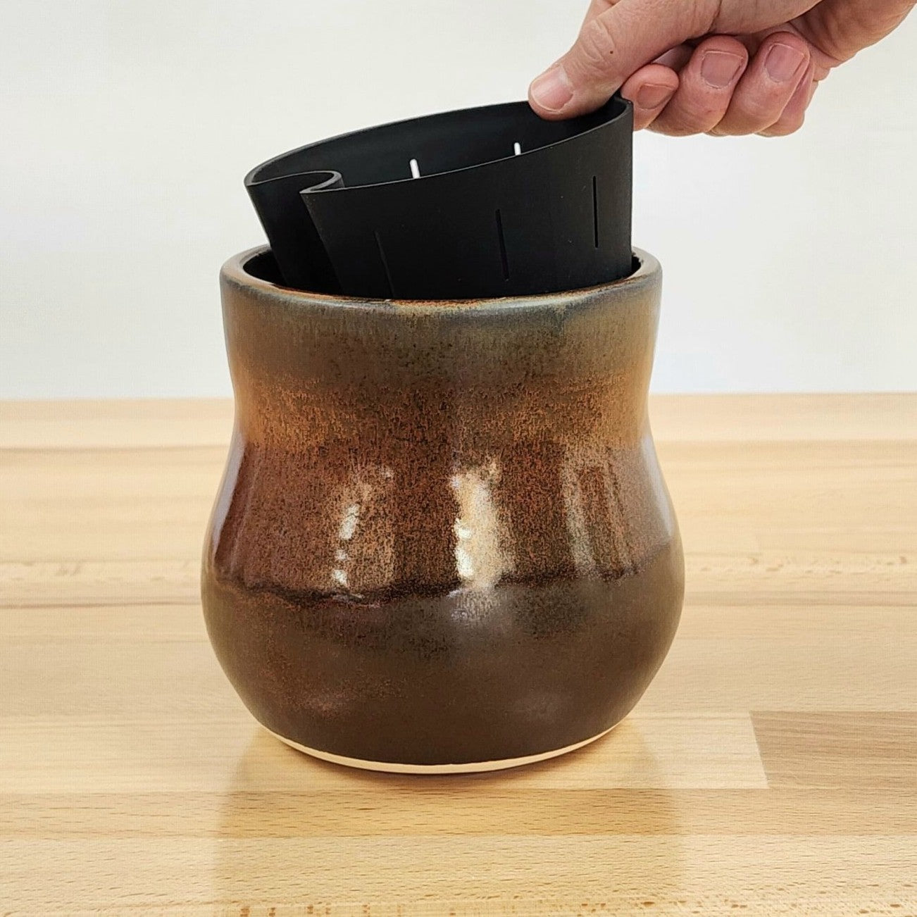 A ceramic Happy Roots Plant Pot in the &