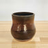 A ceramic Happy Roots Plant Pot in the &